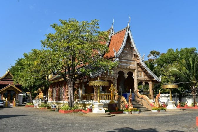 a small building with a lot of trees around it