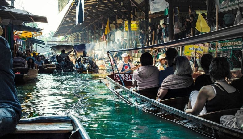 people riding on boat during daytime