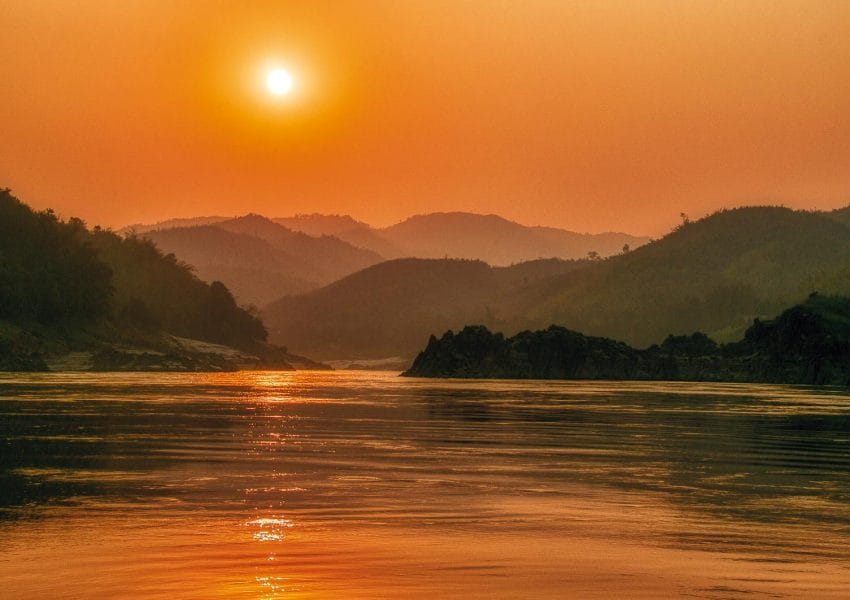 Sunset Over the Mountain Range Near the River