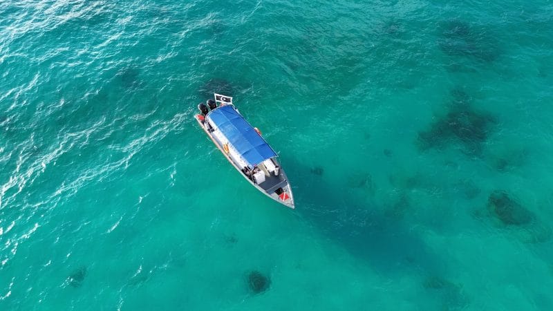 a boat floating on top of a body of water