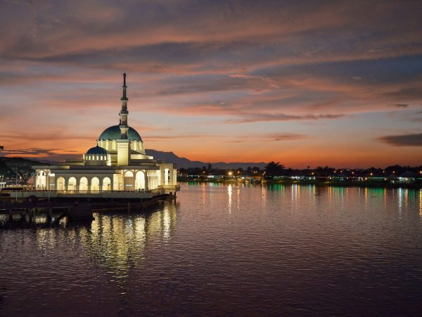 a large building sitting on top of a body of water