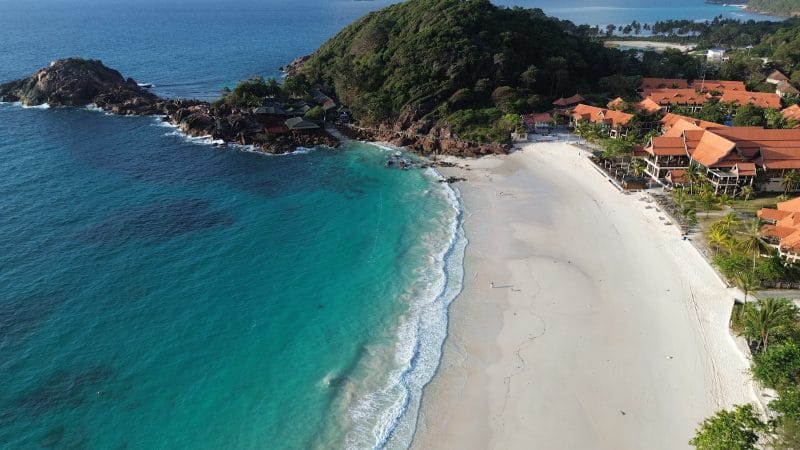 an aerial view of a beach and a resort